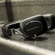 The shiny chrome frame is wrapped in soft leather, and the ear cups come with comfy memory foam.